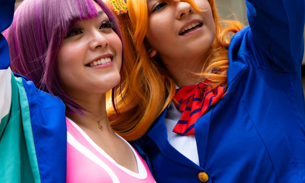 Two Girls with Dyed Hair Posing Together .pexels