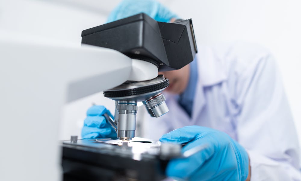 Scientist Using Microscope .pexels