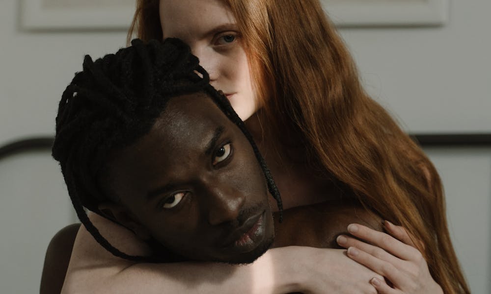 A Woman Hugging a Shirtless Man .pexels