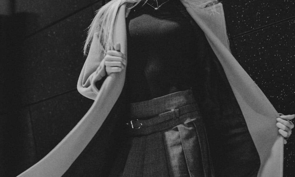 Model in a Wool Coat and Pleated Mini Skirt .pexels