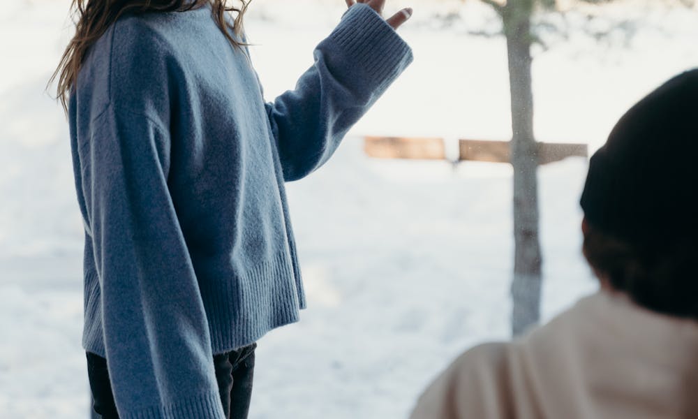 Man Looking at Girlfriend Standing by Window in Hotel Room .pexels