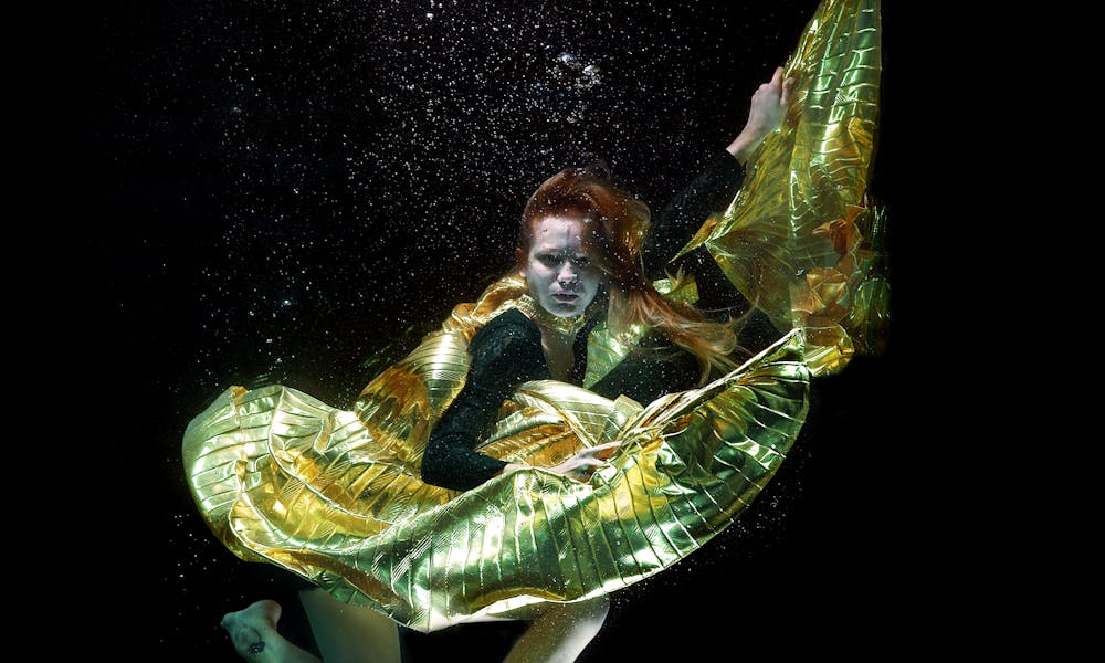 Underwater Photo of Woman Wearing Green and Black Dress .pexels
