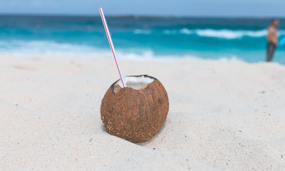 Brown Coconut on Sand .pexels