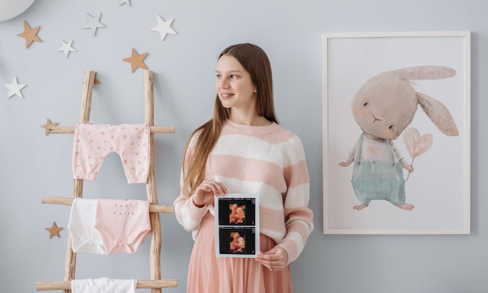 A Pregnant Woman Holding Her Ultrasound Result .pexels