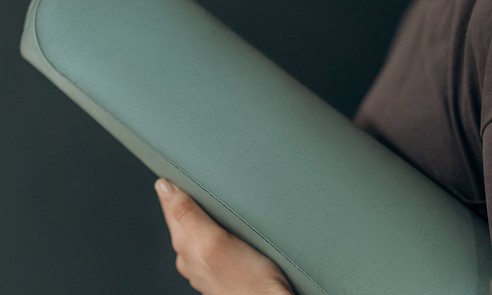 Woman Holding A Yoga Mat .pexels