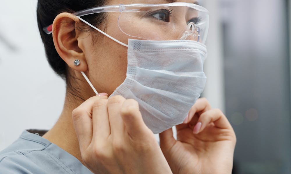 Photo Of Woman Wearing Protective Goggles And Mask .pexels