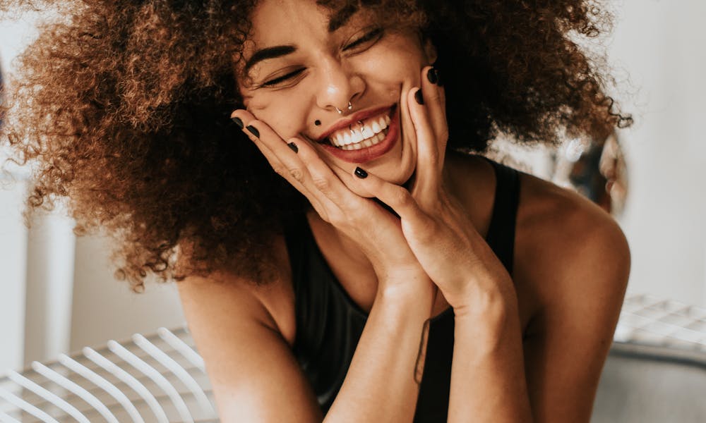Woman Sitting And Smiling .pexels