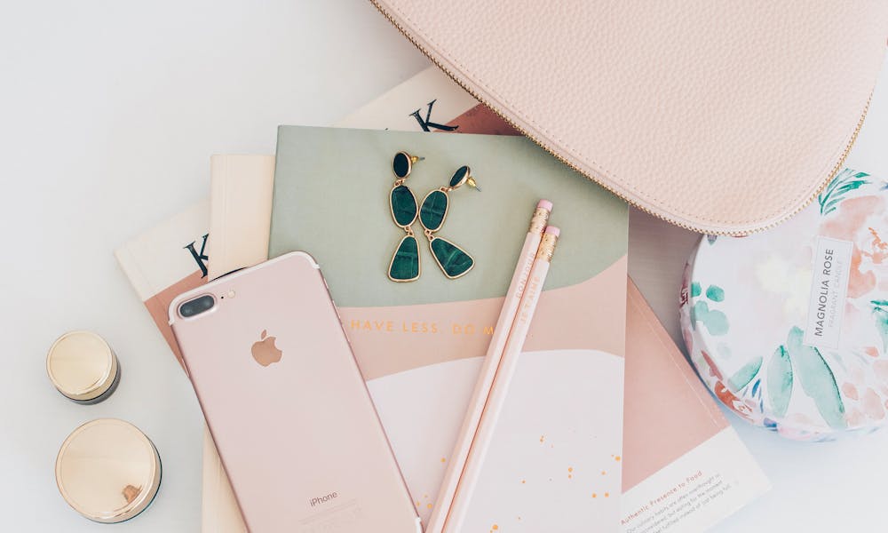 Rose Gold Iphone 7 Plus Beside Pencils on Book .pexels