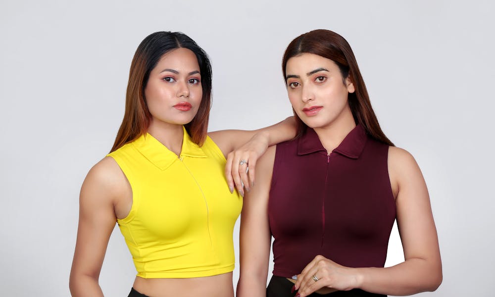 Two women in yellow and maroon tops .pexels