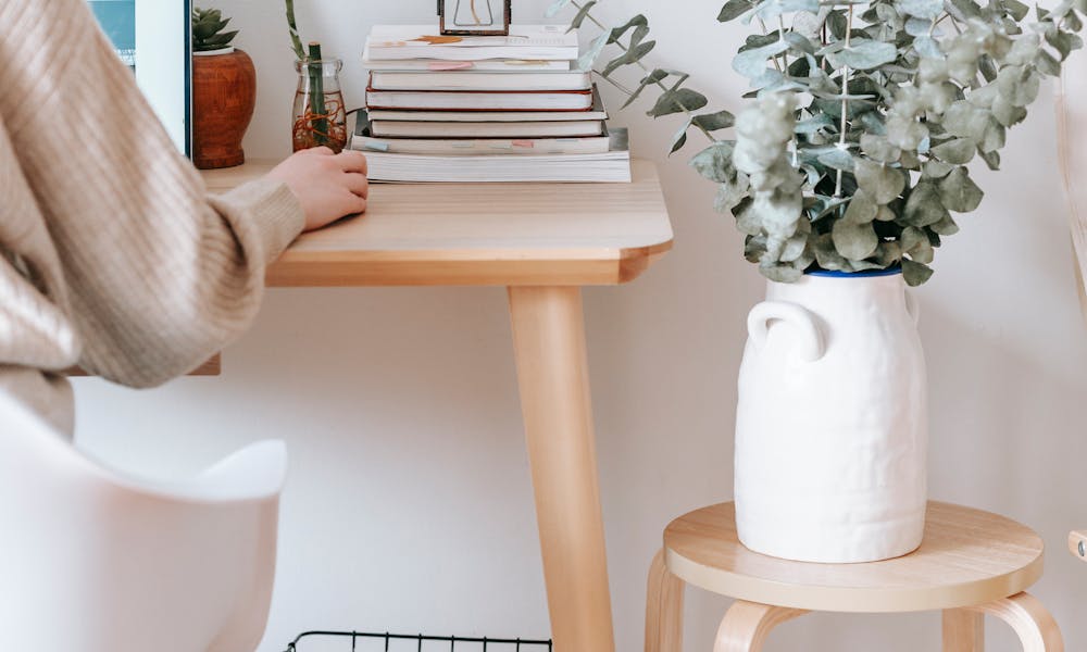 Anonymous woman working on laptop in room .pexels