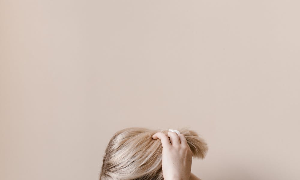 Woman With Blonde Hair Wearing Blue  .pexels