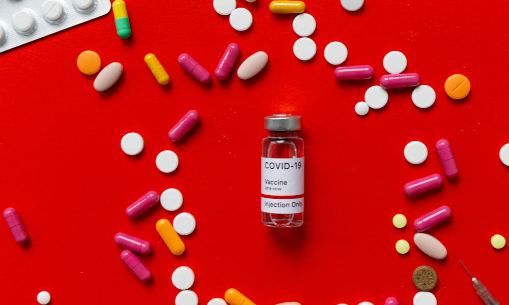A Covid-19 Vaccine and Medication Pills .pexels