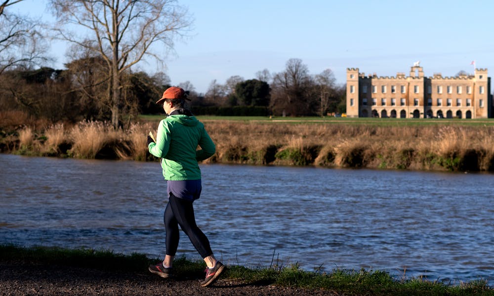 Woman Running by River .pexels