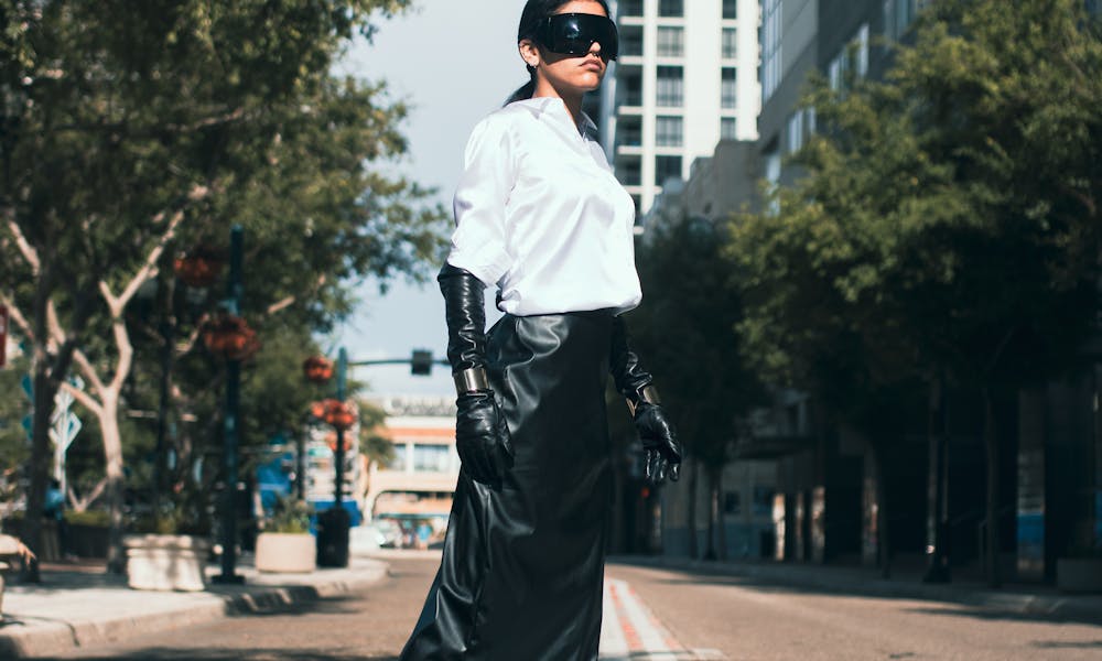 Woman in Skirt, Shirt and Goggles on Street .pexels