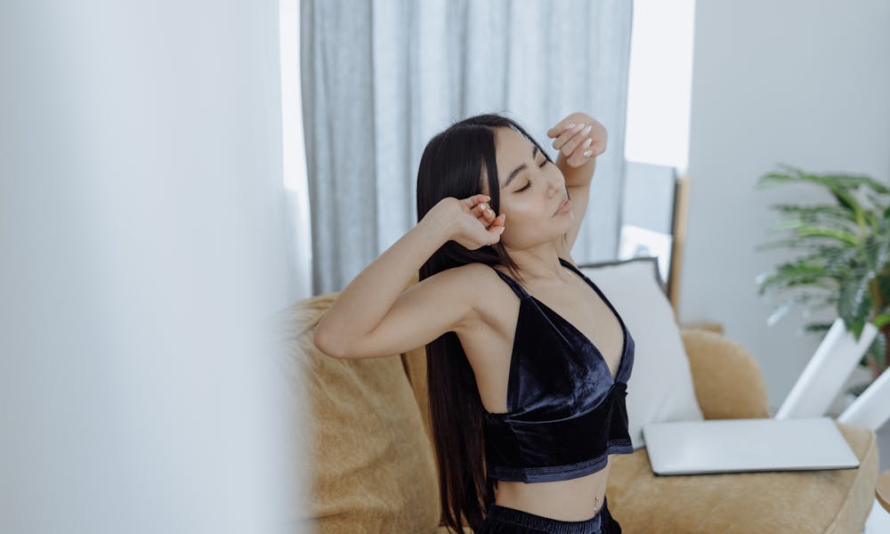 Woman in Tank Top Stretching Her Arms .pexels