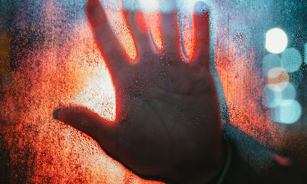 Hand Touching Glass .pexels