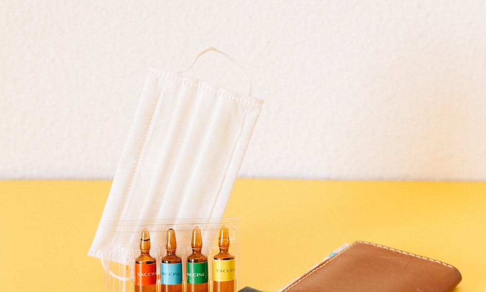 White Ipad on Brown Book .pexels