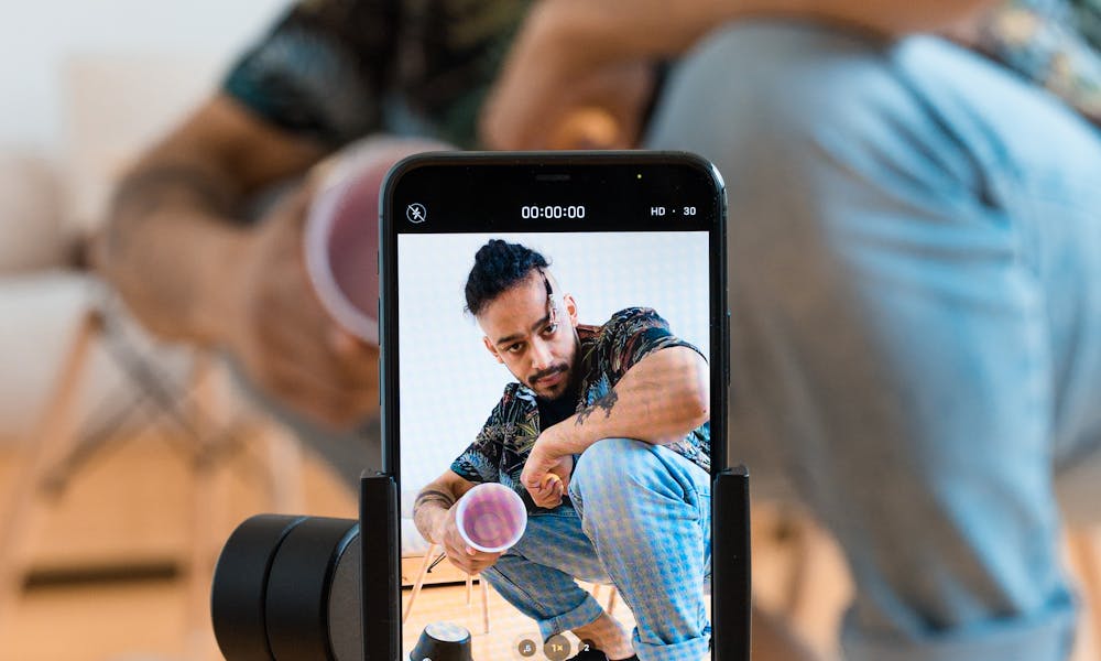 A Man Filming Himself Using His Mobile Phone .pexels