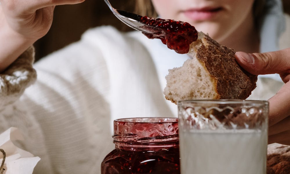 A Woman Eating Breakfast .pexels