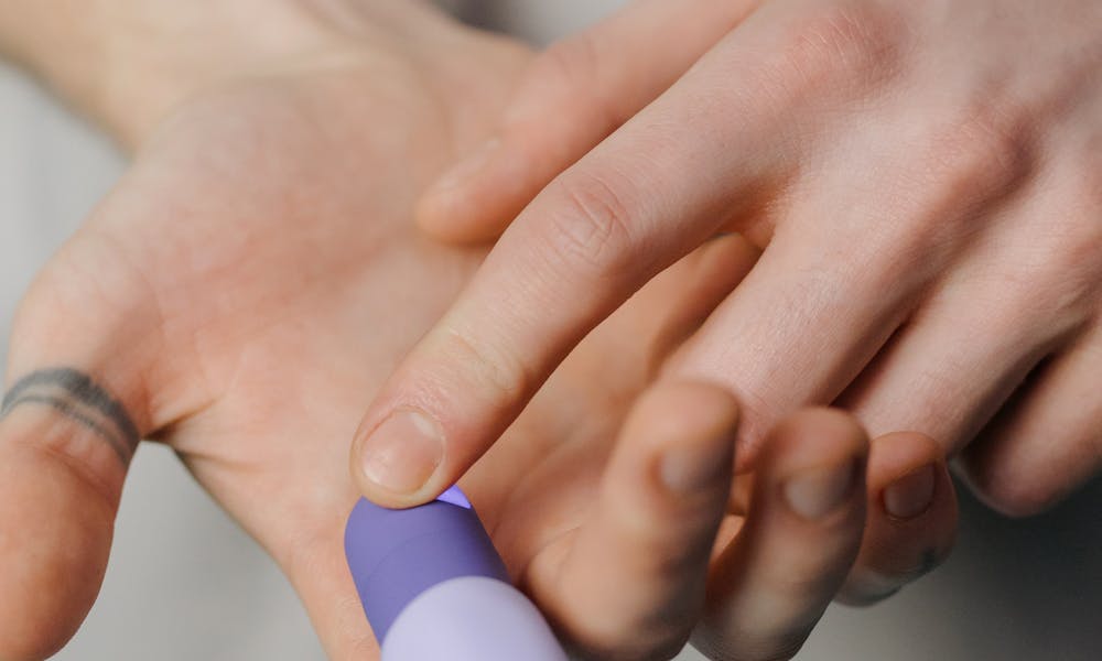 Person Holding a Sex Toy .pexels