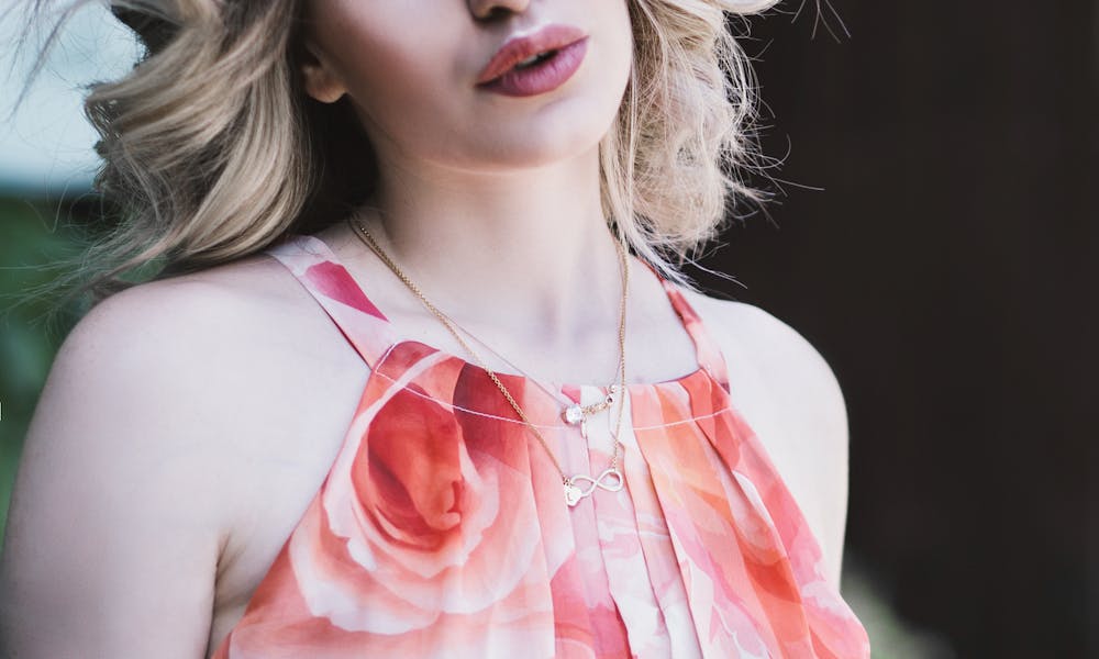 Woman Wearing Pink Floral Spaghetti Tank Top .pexels
