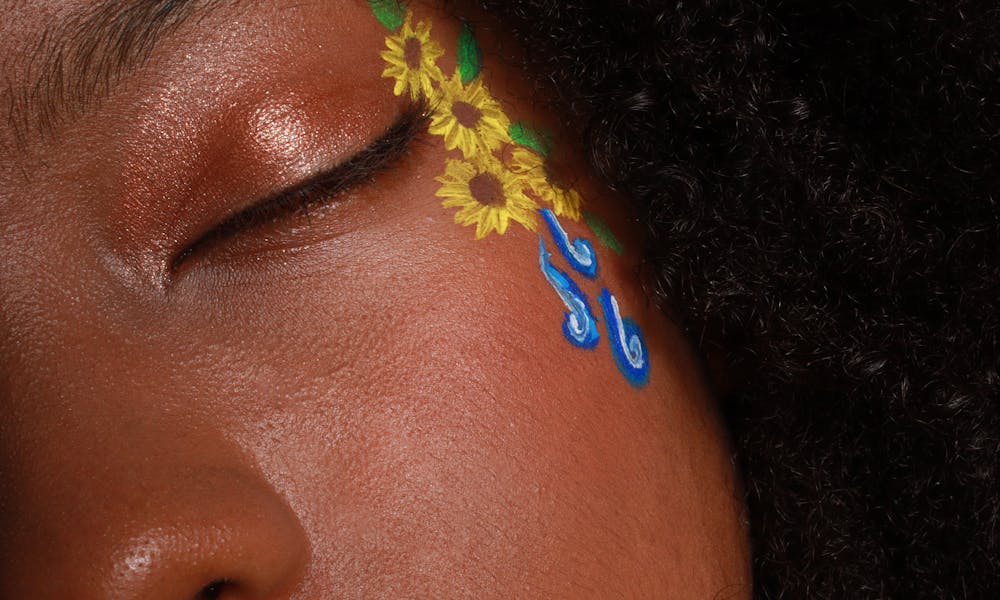 Flowers Painted on Woman Face .pexels