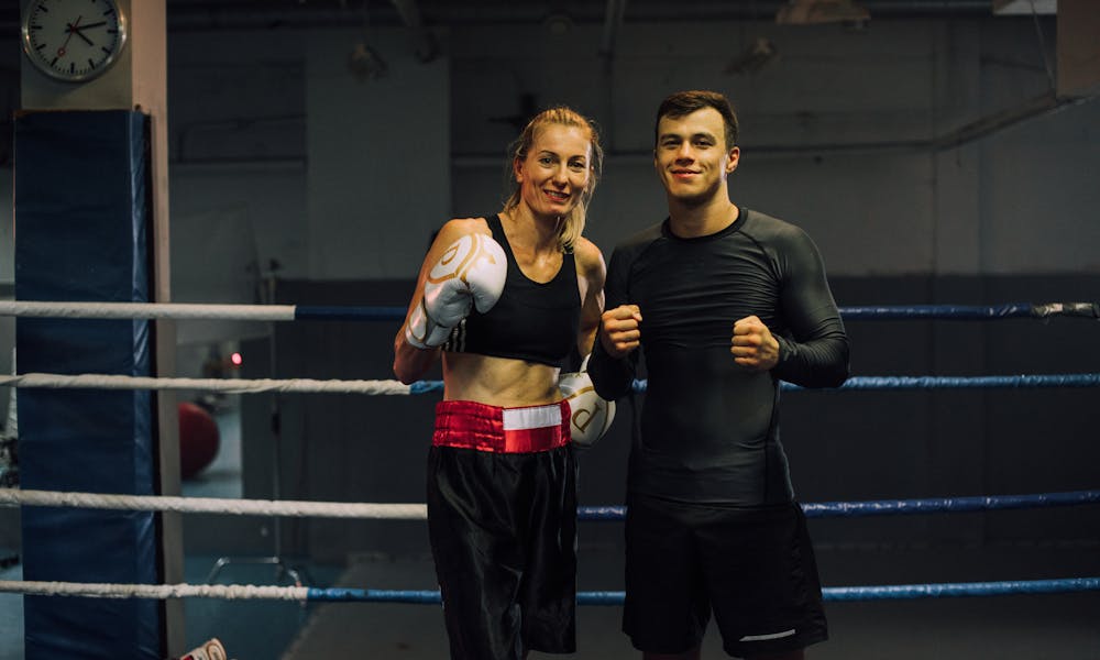 A Man and Woman Inside the Boxing Ring .pexels