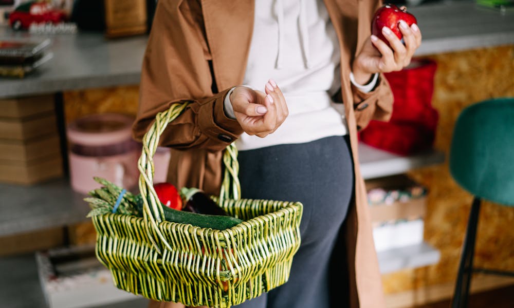 Pregnant Woman Holding Basket with Vegetables  .pexels
