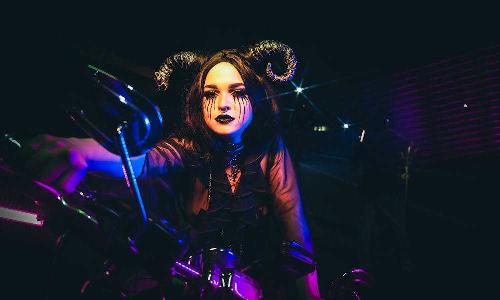 A Woman Wearing a Costume on a Motorcycle .pexels