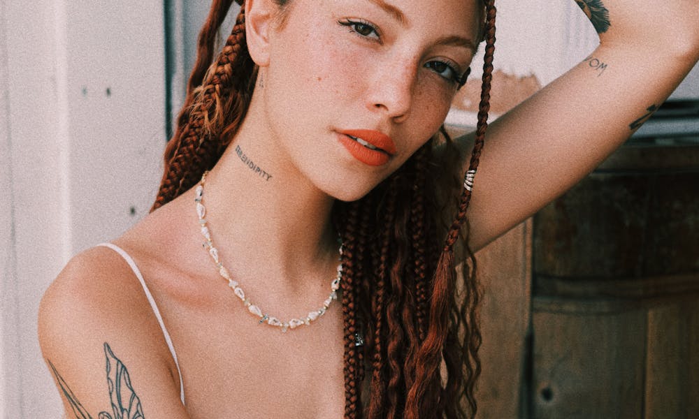 Young Woman with Braided Hair and Tattoos .pexels
