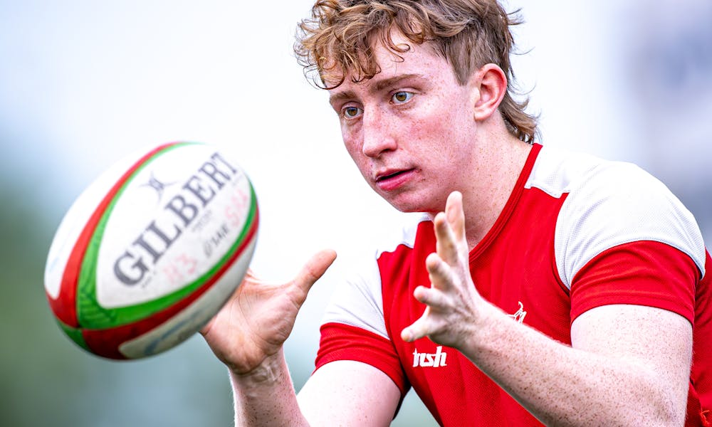 Young Rugby Player Catches Ball Mid-Game .pexels