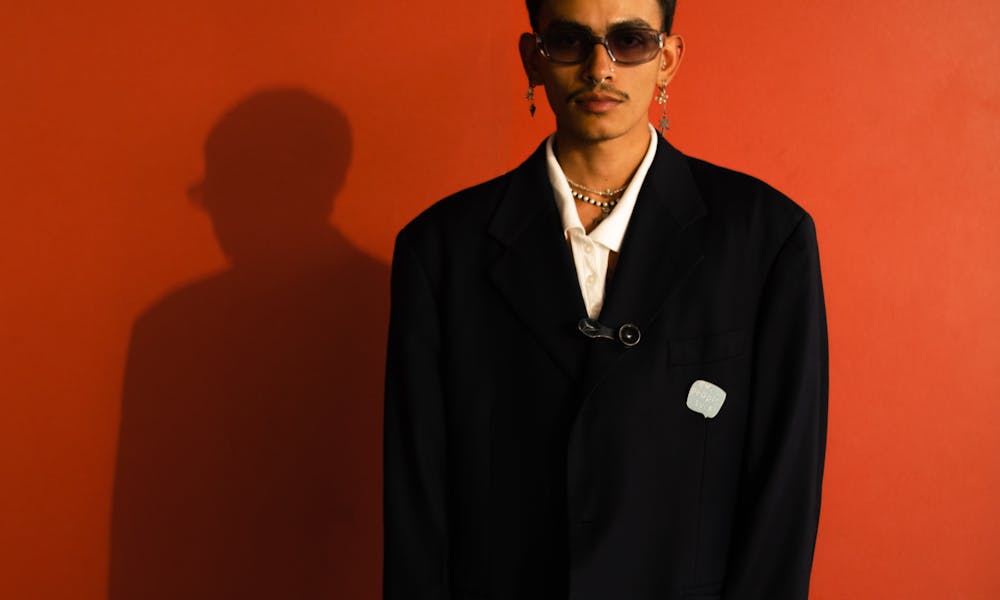 Model in an Oversized Suit Jacket with Earrings and Nose Rings .pexels