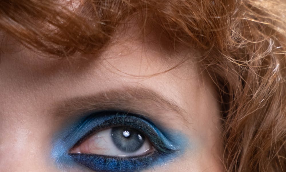 Close-Up Photo of a Woman with Blue Eyeshadow Makeup .pexels