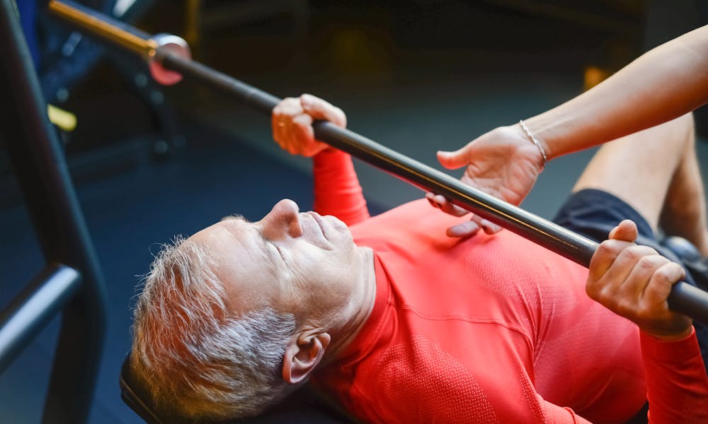 Man Lifting a Bar at the Gym .pexels