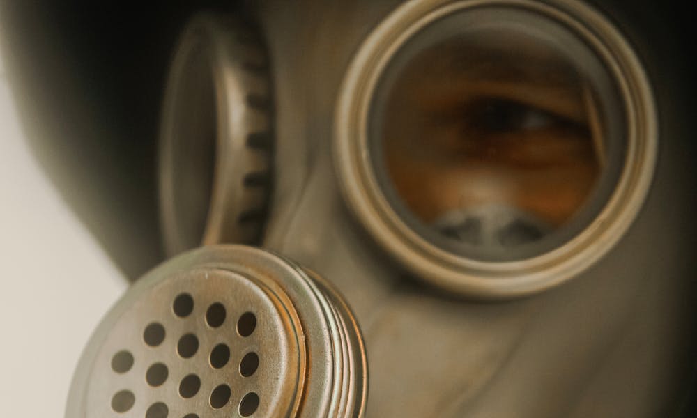 A Close-Up Shot of a Person Wearing a Gas Mask .pexels