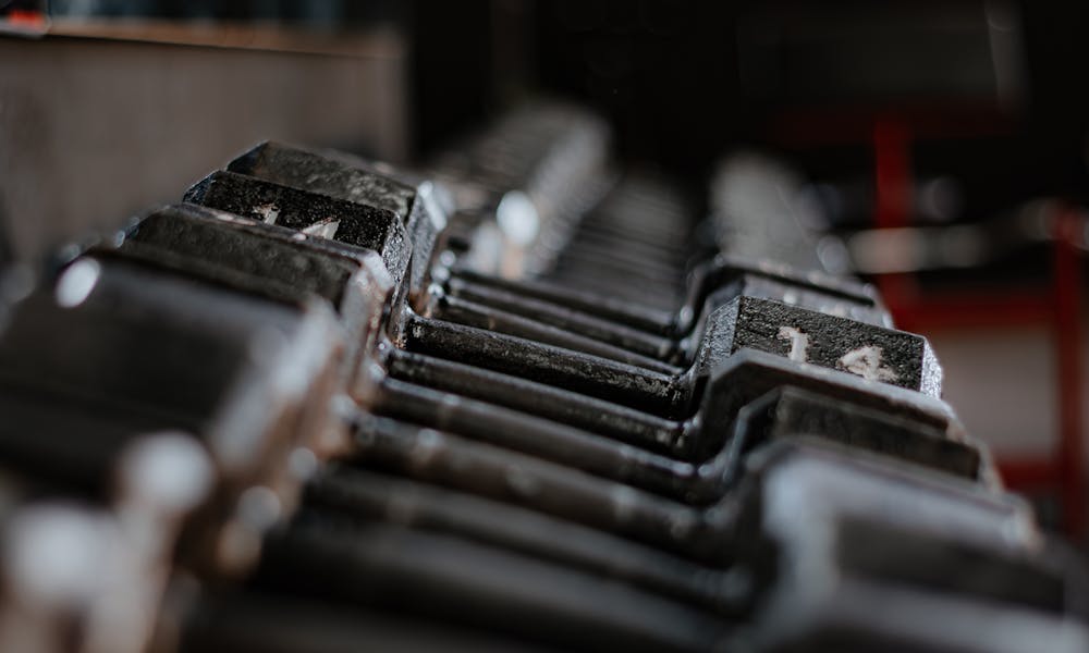 Close-up of Dumbbells in Gym Setting .pexels
