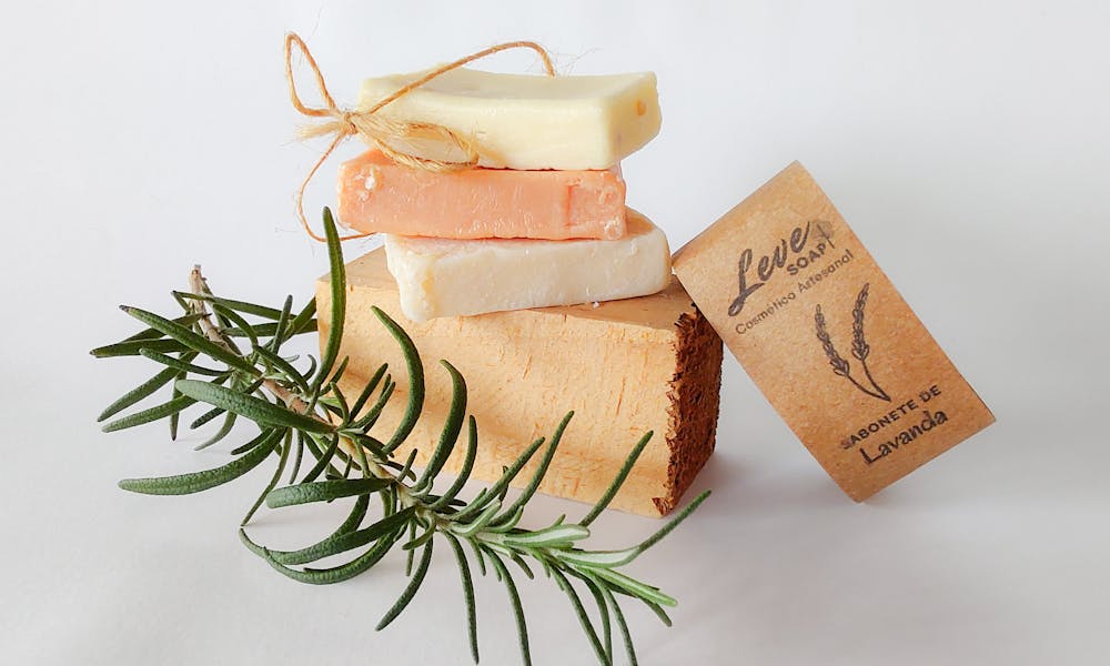 Stacked artisanal soaps with rosemary and lavender, showcasing natural skincare. .pexels