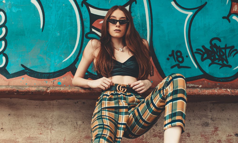 Woman Leaning on Graffiti Wall .pexels