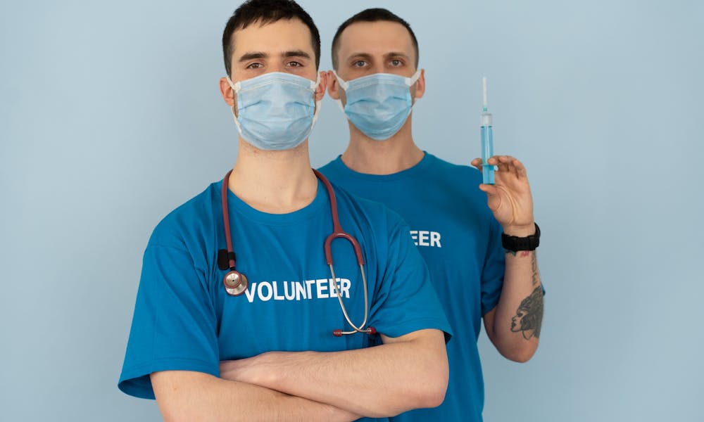Man in Blue Crew Neck T-shirt With White Face Mask .pexels