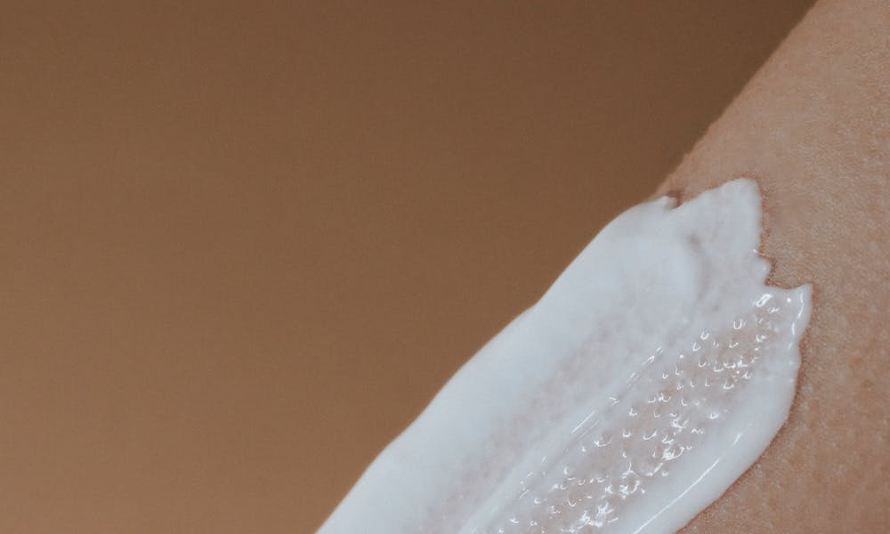 A detailed view of moisturizing cream applied on smooth human skin. .pexels