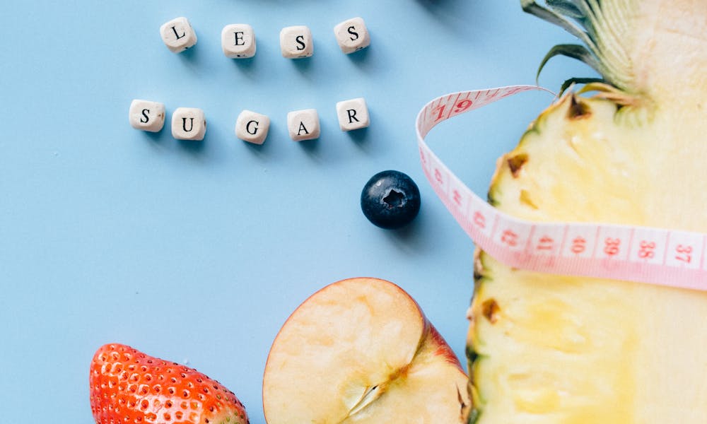 A vibrant composition featuring fresh fruits and health-conscious messaging. .pexels