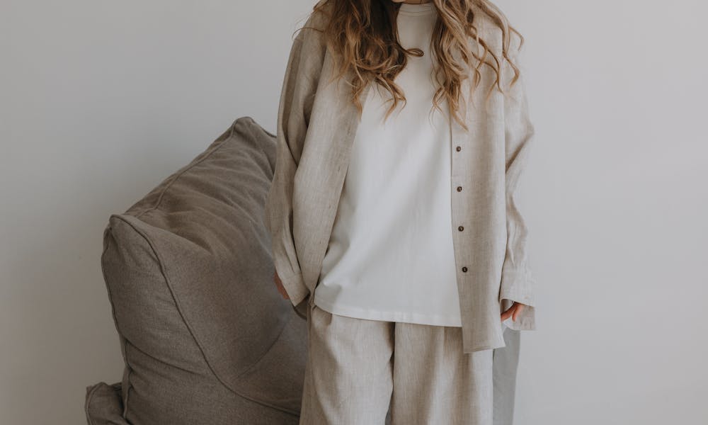 Woman in stylish casual wear beside a bean bag chair. .pexels