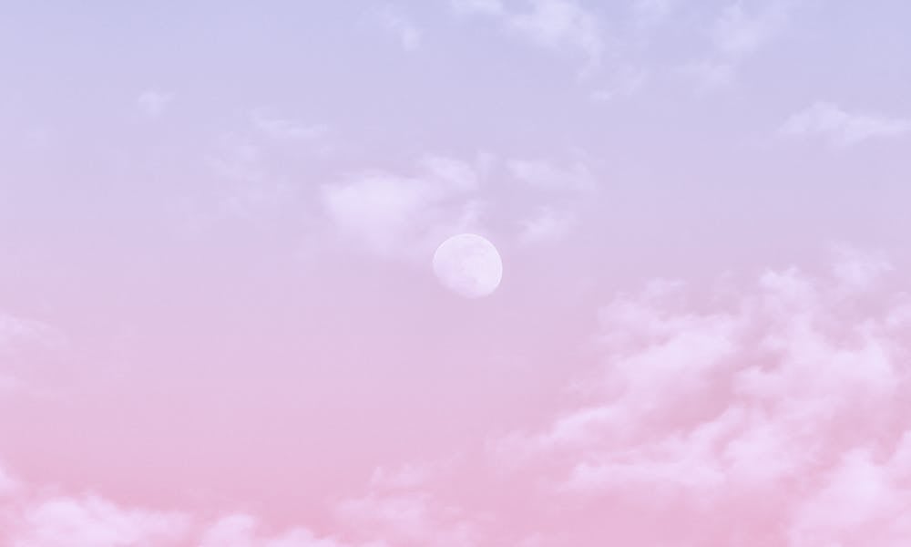 Aesthetic pastel sky with soft clouds and moon, perfect for wallpapers and backgrounds. .pexels