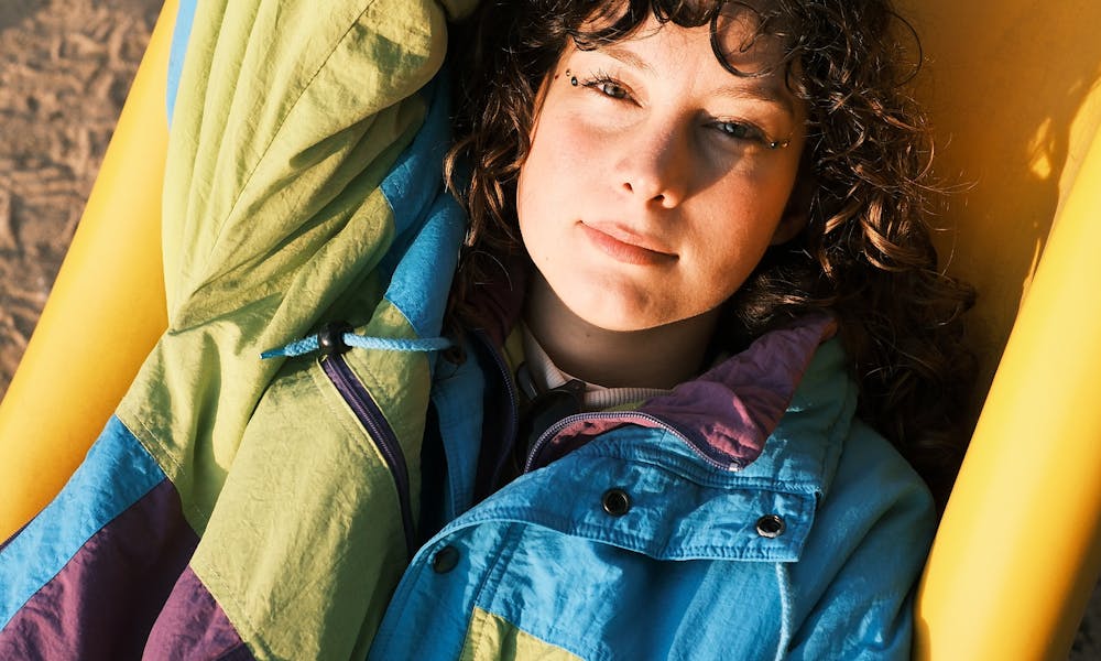 Relaxed Young Woman Enjoying the Sun on a Slide .pexels