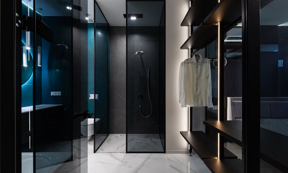 Discover sleek modern design featuring a bathroom with walk-in shower and closet. .pexels
