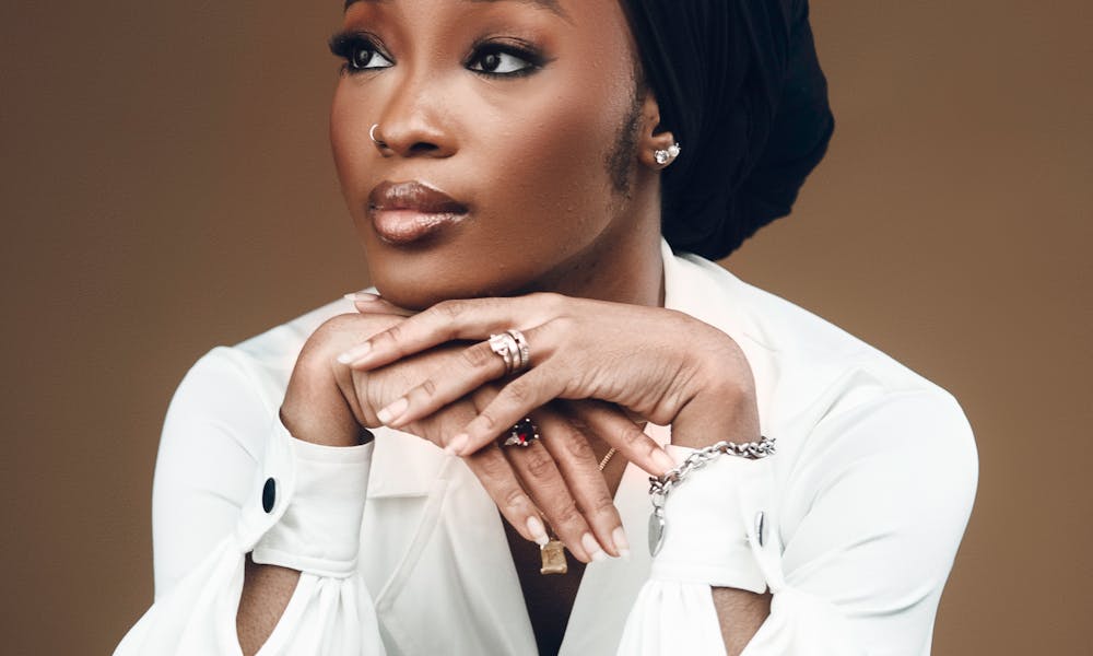 Charming portrait of a woman in white with a neutral background, exuding elegance. .pexels