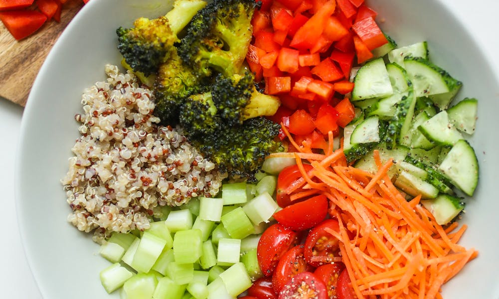 A vibrant bowl of fresh vegetables and quinoa, perfect for a healthy meal. .pexels